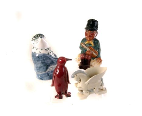 A small group of ceramic figures, including a candle snuff, a pair of Wade Pegasus figures, a Rye pottery bull and cow figure