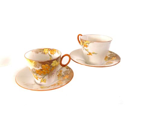 An Art Deco Shelley part six setting tea set, having bright floral decoration, heightened with orange rim, marked 12517 to ba