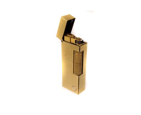A gold plated Dunhill Rollagas lighter, with hobnail engine turned decoration