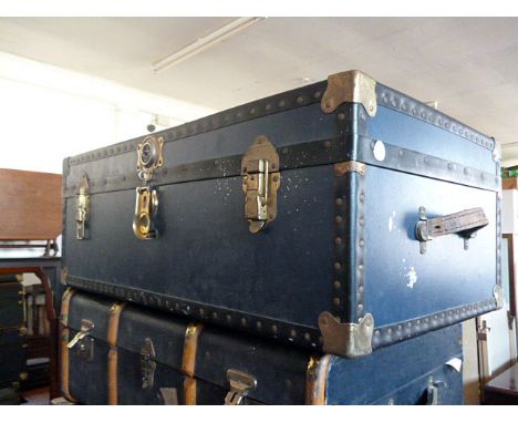 A Mossman blue travelling trunk, having brass fittings