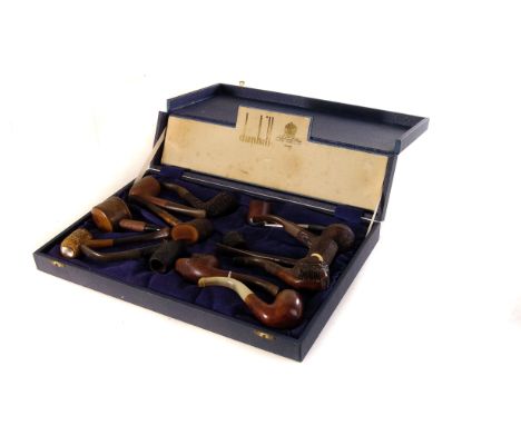 A large collection of smoking pipes, including a Charatan sand blasted briar, Dunhill Shell Briar, Vulcanite Lady's leg novel