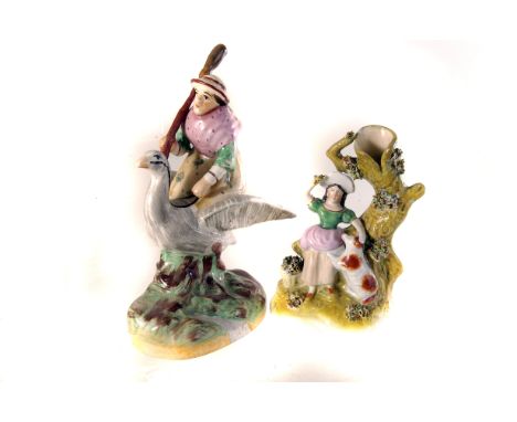 A selection of small 18th century Staffordshire ceramic items, to include a mother goose figure, Roger Giles, a spill vase, a