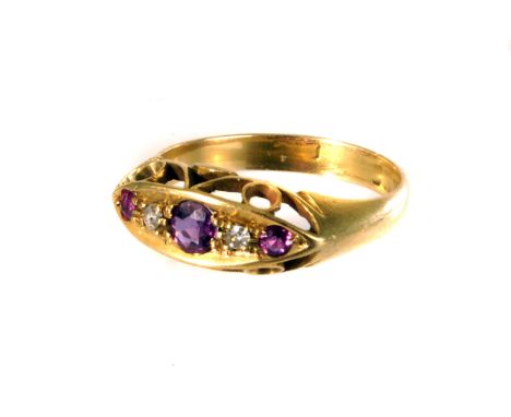 An 18ct gold ruby and diamond dress ring, the alternating stones set in a boat shaped half hoop mount, comprising of three ru