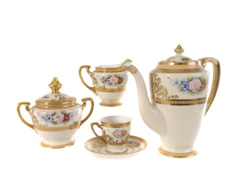 A Noritake porcelain six setting coffee service, with floral decoration, heightened with gilt, comprising coffee pot, six cup