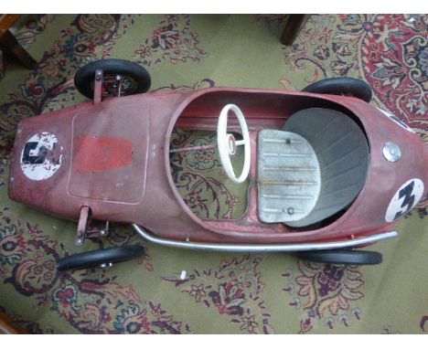 Vintage metal Triang Ferrari pedal car in red, play worn with No.3 decals