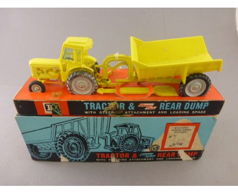 Boxed Britains 9630 Tractor & Rear Dump with steering attachment and loading space in yellow, die-cast vg with wear to wheels
