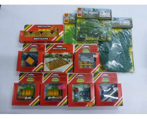 11 Boxed and unopened Britains Farm accessories to include 9539 Animal/Bale Transporter x 2, 9551 Mini Trailer, 9559 Yard Scr