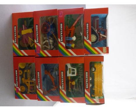 Eight boxed Britains farm vehicles including 9499 Tumbrel Cart, 9536 Rear Mounted Digger, 9555 Animal Trailer, 9535 Potato Ha