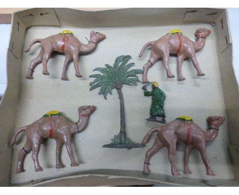 Vintage set of four metal Camels plus tree and figure