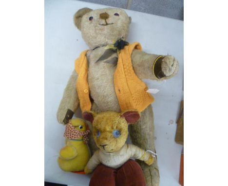 A group of three soft toys comprising of an early German teddy bear with jointed limbs, a duck by ByBak Germany with tag CA55