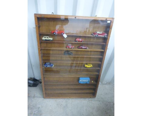 Wooden display cabinet with plastic front and 9 loose die-cast vehicles including Corgi British Leyland Mini 1000, Mercedes B