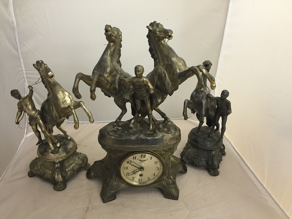 An early 20th century Marley horse clock garniture