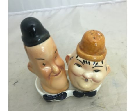 A ceramic cruet set in the form of Laurel and Hardy