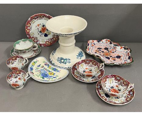 A collection of antique Mile Mason’s tea and coffee cups, dessert dish and vintage Mason’s ham stand and a dish