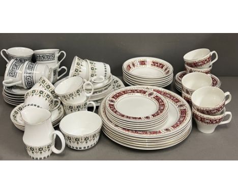 A mixed selection of bone china in three different patterns, cups and saucers, plates, etc 