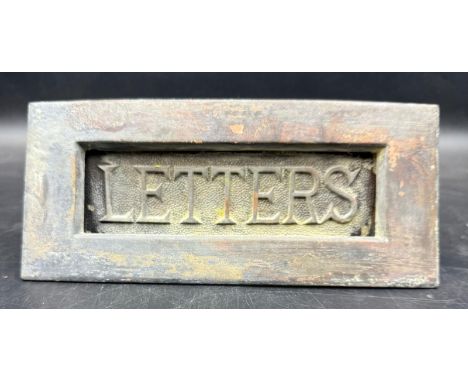 A vintage lead letter box plate 