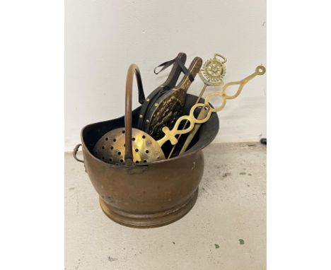 A brass coal scuttle and tools 