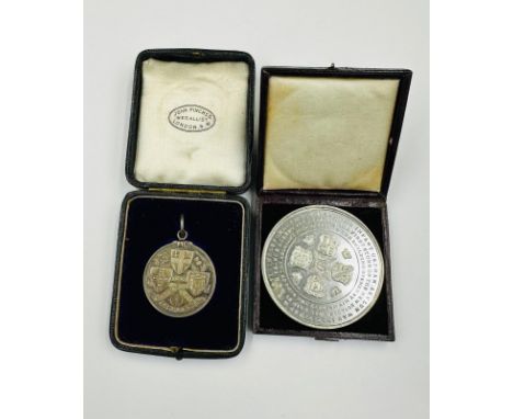 Two vintage medallions: The Infant Orphan Asylum and 1885 North Road Cycling Club