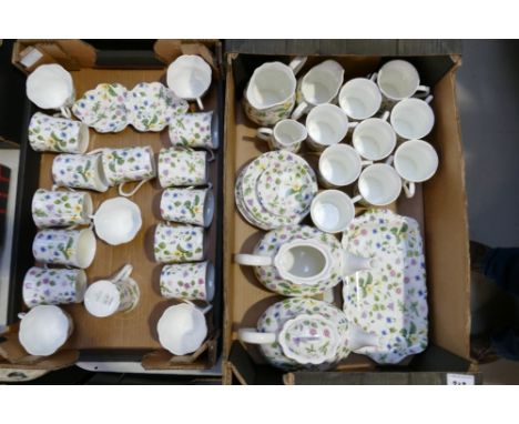 A large collection of floral decorated Queens branded Country Meadow patterned tea mugs, cups, saucers, tea pots etc (2 trays