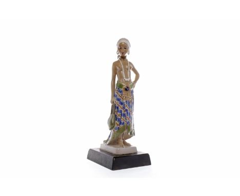 JENS PETER DAHL-JEHSEN FIGURE OF A BALINESE WOMANmodelled as standing half nude holding a bag, raised on a rectangular cerami