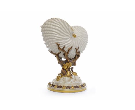 VICTORIAN ROYAL WORCESTER NAUTILUS SHELL circa 1881, with gilded highlighted edges raised on a naturalistic coral stem, with 
