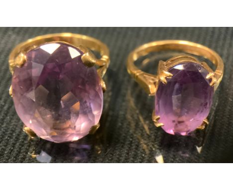 A 9ct gold pale pinky purple amethyst dress ring, size O/P, 8.6g gross;  another smaller, size M, 4.3g gross (2) 