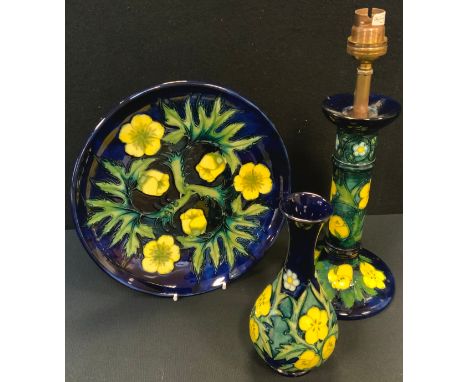 A Moorcroft candlestick table lamp, tube lined in the Buttercup design, 28cm high overall, conforming vase, 16.5cm high,  and