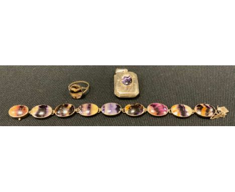 A blue john fluorite nine panel bracelet, unmarked silver mount, 18.6cm long;  oval dress ring;  canted rectangular locket, 3