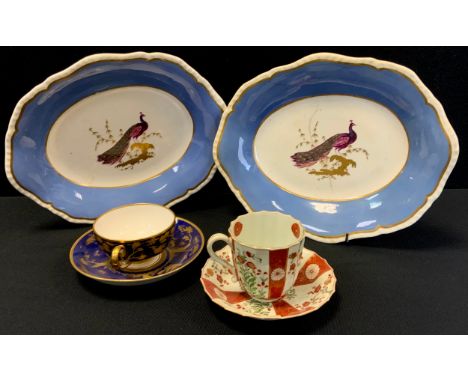 A pair of 19th century porcelain oval bowls, decorated in puce and gilt with Peacocks, pale blue and gilt border, unmarked, 2