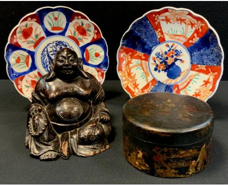 A Chinese silver inlaid carved figure, Laughing Buddha, smiling seated holding beads, fan 16.5cm high;  Japanese Lacquered bo