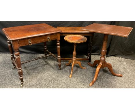 A 19th century mahogany side table, rounded rectangular top, single drawer to frieze, H-stretcher, turned legs, brass casters