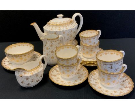 A Spode Fleur de Lys gold pattern tea set, for six inc teapot, six, cups, saucers, side plates, cream jug, milk jug and sugar