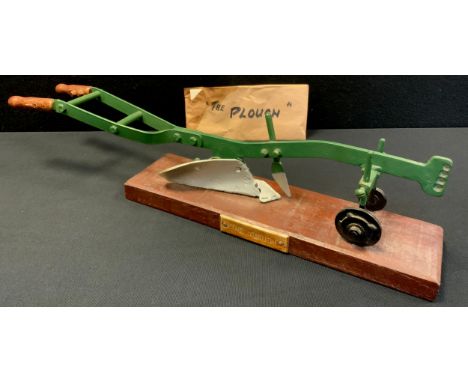 A hand made model Plough, being a copy of an R Hornsby &amp; Son two horse cast iron plough, c.,1910, made by T G Ballance, f
