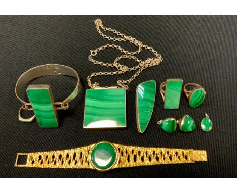 A malachite silver mounted rectangular panel bangle,  Sheffield 1977;  similar pendant necklace, dress ring;  tri form earrin