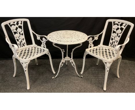 An early 20th century, white painted metal, garden bistro set, comprising small tripod base table, 67cm high x 60cm diameter,