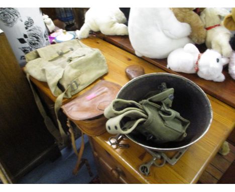 A group of military and associated items to include a leather and brass Sykes patent powder flask