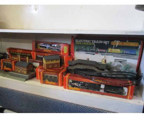 A selection of Hornby 00 gauge toy trains and accessories to include a boxed engine