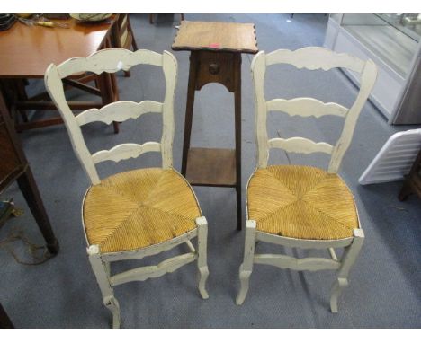A pair of French white painted rush seated ladder back chairs, together with an oak plant stand
