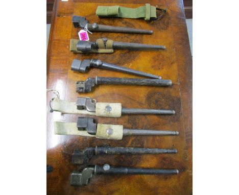 A group of Second World War stick bayonets in sheaths, some with belt webbing to include a No.4 Mk II bayonet (8)