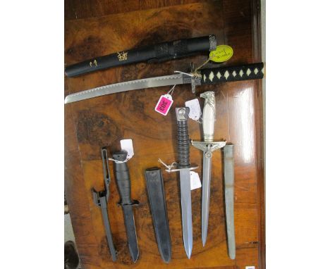 An Ancient Warrior modern model of a Japanese sword, an F.W. Holler, Berlin dagger and sheath, with eagle head pommel, white 