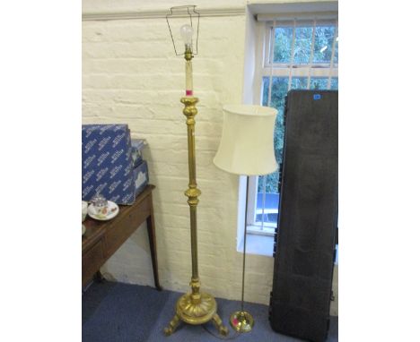 A modern gilt wood standard lamp with a turned column, 58 h and a brass standard lamp