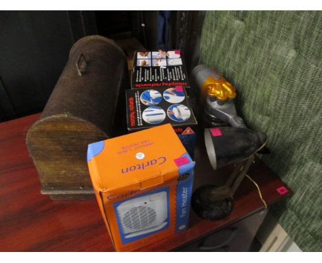 A mixed lot to include a sewing machine, a table lamp, a Dyson hoover and boxed electricals