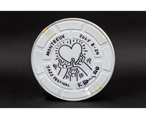 HARING KEITH (1958 - 1990)Keith Haring signed and (19)83 dated drawing in black felt-tip pen on a round film roll box with th