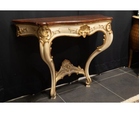 antique presumably French Louis XV style console in polychromed and sculpted wood and with a "trompe l'oeil" marble topAntiek