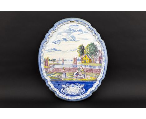 antique plaque in Dutch ceramic with a polychrome decor with an animated landscape restoredAntieke cartouchevormige plaket in
