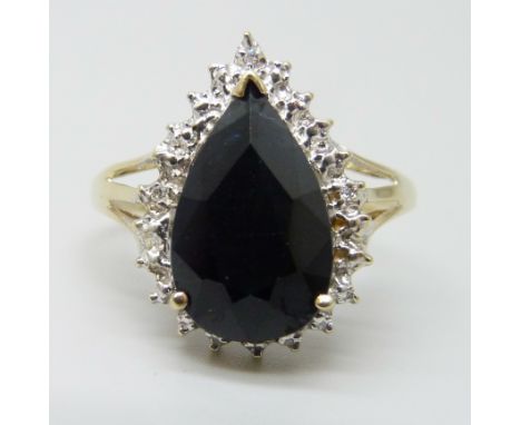 A 9ct gold ring set with a sapphire and diamonds, 3.1g, R