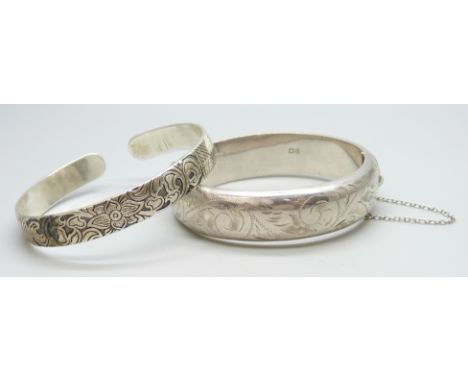 A plated torque bangle, (a/f scratched), together with an engraved silver bangle with inscription to outer band, 24g