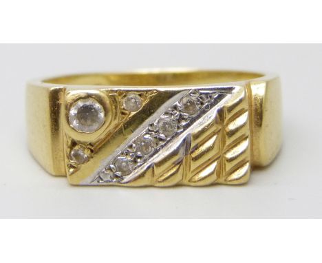 An 18ct gold ring set with white stones, 6.7g, U