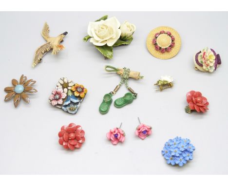 A collection of vintage plastic brooches and a metal example 