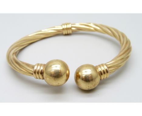 An Italian 9ct gold torque bangle, hinged opening, 10.3g, 5.8 x 4.7cm